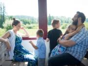 Andrea and David Jordan ride the Chelatchie Prairie Railroad with their children Sam, 4, Caris, 6, and Laith, 8, in Yacolt on Sunday. Riding the train on Father’s Day has become tradition for the Jordan family.