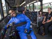 Nate Habtom laughs while riding a C-Tran bus bound for Portland with C-Tran Travel Trainer Jade Dudley, far right, during a training session last week. The two have become friends over the last year that Habtom has trained with Dudley, who focuses much of her work on helping seniors and those with disabilities. “It’s helping them gain or maintain independence. There’s really no greater gift than seeing that spark for them,” Dudley said.