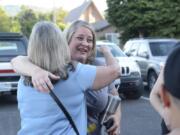 Shauna Walters of Battle Ground hugs a supporter outside Yacolt Town Hall after the town council voted to declare itself a sanctuary from Initiative 1639, a gun measure state voters passed in November.