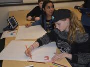 Washougal: Jemtegaard Middle School students Anastasia Kirillov and Jada’lynn Iriarte work on posters for hallways to inspire positive thoughts. The school recently won the Whole Child Award from the Washington State Association for Supervision and Curriculum Development, which honors a school that has created a positive culture for student development.