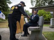 Former Cmdr. Ed Barnes, left, and Cmdr. Ralph Hager, right, greet one another during the remembrance ceremony for the 69th anniversary of the Korean War at the Clark County Korean War monument on the Vancouver Veterans Affairs campus on Tuesday, June 25, 2019.