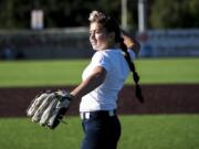 Elizabeth Peery throws out the first pitch at the Ridgefield Raptors game Friday, where she was honored for making the finals of the national Pitch, Hit & Run competition.