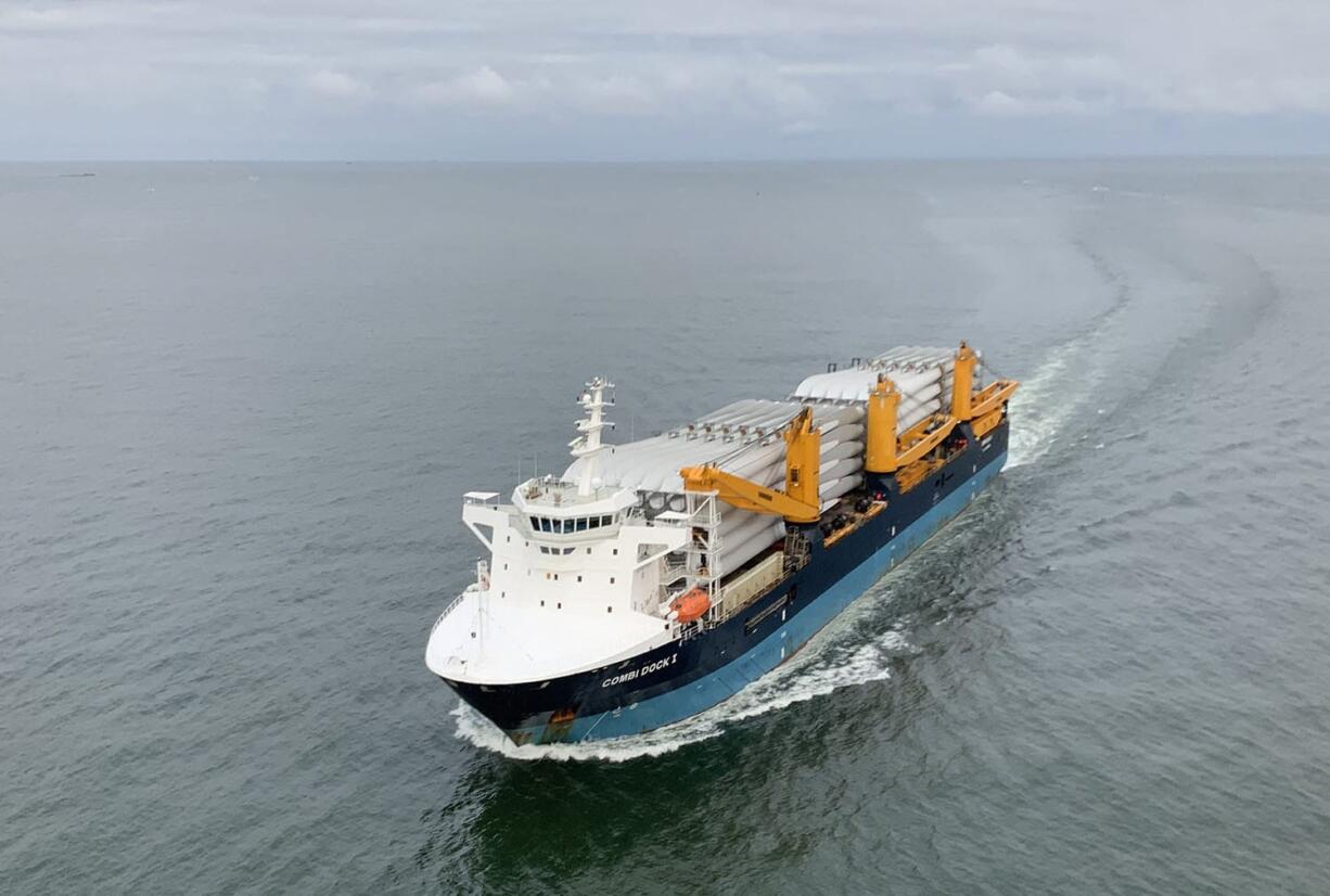 A cargo ship carrying a record-breaking load of 198 wind turbine blades navigates through the entrance to the Columbia River on its way to the Port of Vancouver. The blades will be unloaded this week and trucked to a wind farm near Dayton.