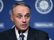 Baseball Commissioner Rob Manfred addresses reporters before a baseball game between the Seattle Mariners and the Houston Astros on Tuesday, June 4, 2019, in Seattle.