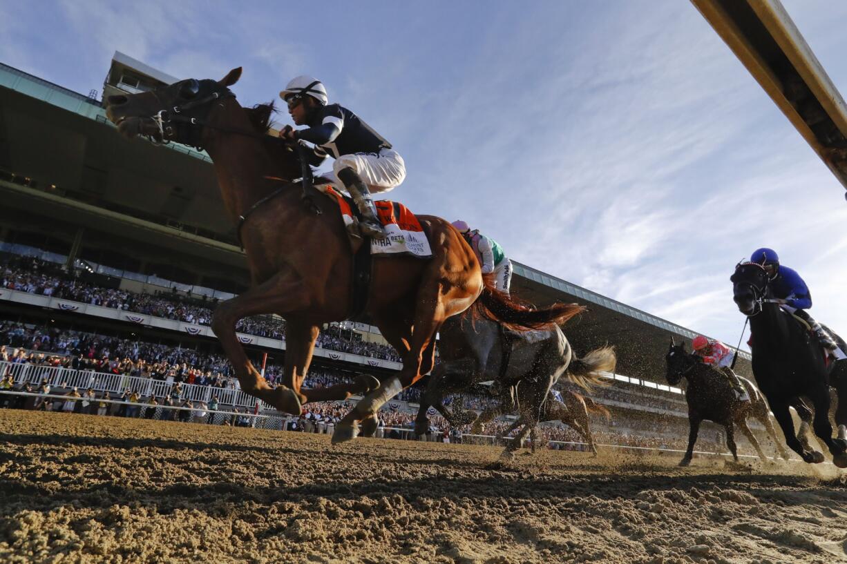 Sir Winston (7), with jockey Joel Rosario up, crosses the finish line to win the 151st running of the Belmont Stakes horse race, Saturday, June 8, 2019, in Elmont, N.Y.