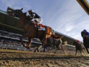 Sir Winston (7), with jockey Joel Rosario up, crosses the finish line to win the 151st running of the Belmont Stakes horse race, Saturday, June 8, 2019, in Elmont, N.Y.