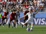 United States'Megan Rapinoe scores her side's second goal from a penalty spot during the Women's World Cup round of 16 soccer match between Spain and US at the Stade Auguste-Delaune in Reims, France, Monday, June 24, 2019.