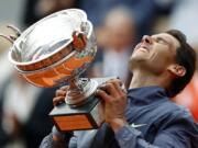 Spain’s Rafael Nadal lifts the cup after defeating Austria’s Dominic Thiem in their men’s final match of the French Open tennis tournament at the Roland Garros stadium in Paris, Sunday, June 9, 2019. Nadal won 6-3, 5-7, 6-1, 6-1.