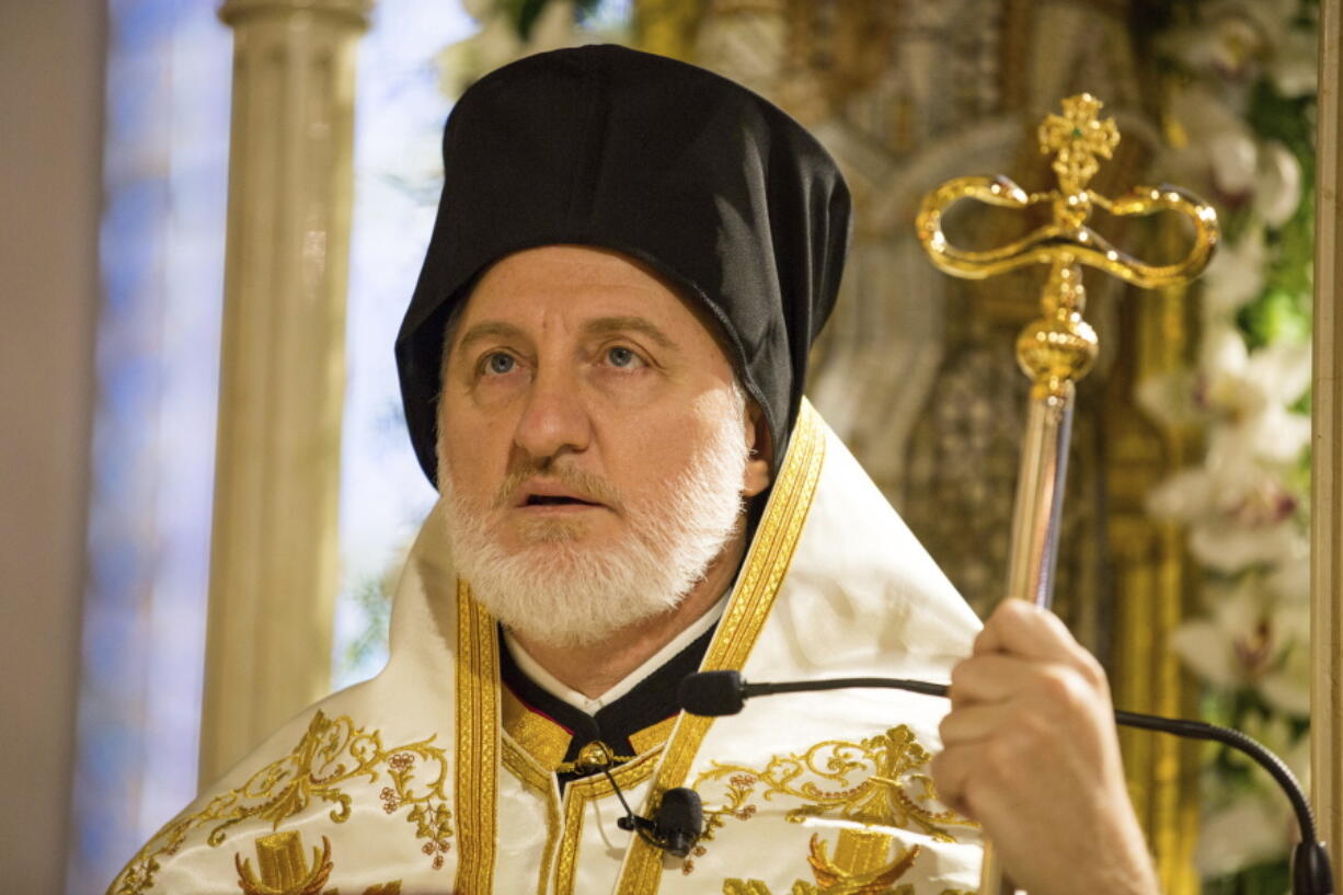 Archbishop Elpidophoros stands at his throne inside the Archdiocesan Cathedral of the Holy Trinity during his enthronement ceremony Saturday in New York.