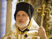 Archbishop Elpidophoros stands at his throne inside the Archdiocesan Cathedral of the Holy Trinity during his enthronement ceremony Saturday in New York.