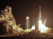 A SpaceX Falcon heavy rocket lifts off from pad 39A at the Kennedy Space Center in Cape Canaveral, Fla., early Tuesday, June 25, 2019. The Falcon rocket has a payload military and scientific research satellites.