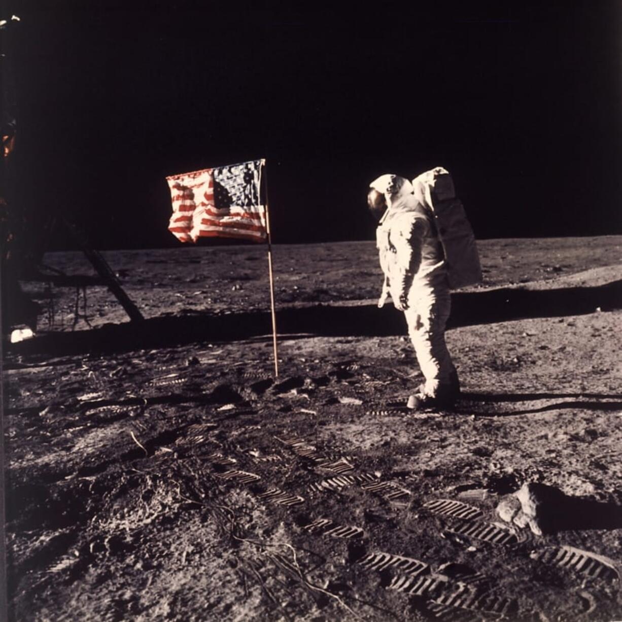 FILE - In this image provided by NASA, astronaut Buzz Aldrin poses for a photograph beside the U.S. flag deployed on the moon during the Apollo 11 mission on July 20, 1969. A new poll shows most Americans prefer focusing on potential asteroid impacts over a return to the moon. The survey by The Associated Press and the NORC Center for Public Affairs Research was released Thursday, June 20, one month before the 50th anniversary of Neil Armstrong and Aldrin’s momentous lunar landing. (Neil A.