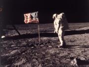 FILE - In this image provided by NASA, astronaut Buzz Aldrin poses for a photograph beside the U.S. flag deployed on the moon during the Apollo 11 mission on July 20, 1969. A new poll shows most Americans prefer focusing on potential asteroid impacts over a return to the moon. The survey by The Associated Press and the NORC Center for Public Affairs Research was released Thursday, June 20, one month before the 50th anniversary of Neil Armstrong and Aldrin’s momentous lunar landing. (Neil A.