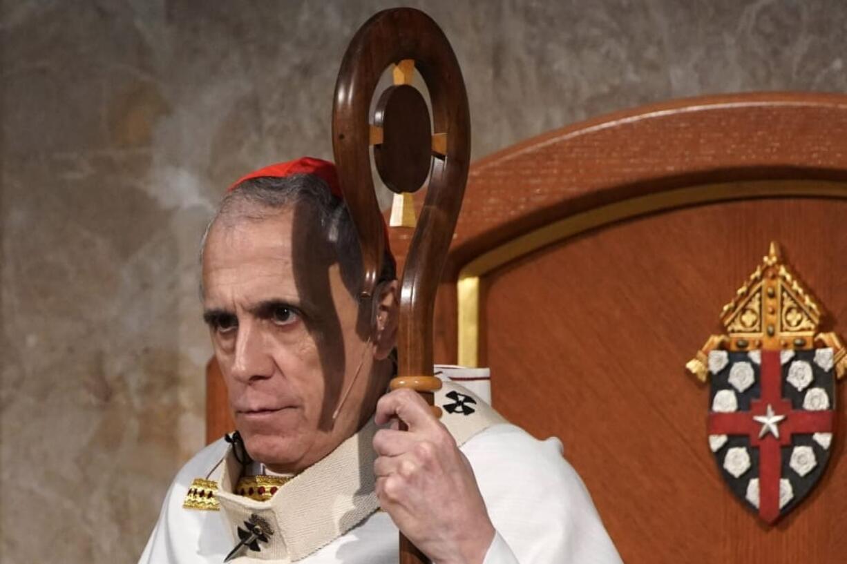 FILE - In this Saturday, June 1, 2019 file photo, Cardinal Daniel DiNardo presides over a Mass of Ordination for seven candidates for the priesthood at the Co-Cathedral of the Sacred Heart in Houston. On June 4, The Associated Press reported on a Houston woman’s allegations that DiNardo mishandled her case alleging sexual and financial misconduct by his deputy. The archdiocese say it “categorically rejects” the story as biased and one-sided. (AP Photo/David J.