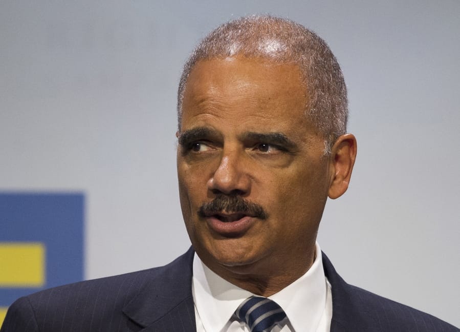 FILE - In this Sept. 15, 2018 file photo, former Attorney General Eric Holder addresses the Human Rights Campaign National Dinner in Washington, D.C. Virginians will elect members of the House of Delegates this year using a map seen as favorable to Democrats, according to a ruling Monday, June 17, 2019 by the U.S. Supreme Court. The lawsuit challenging the original House lines was backed by the National Democratic Redistricting Committee, led by former U.S. Attorney General Eric Holder.