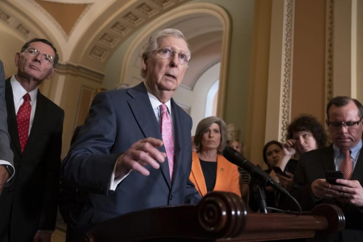 Senate Majority Leader Mitch McConnell, R-Ky., joined at left by Sen. John Barrasso, R-Wyo., and Sen. Joni Ernst, R-Iowa, right, speaks to reporters following the Republican Conference luncheon, at the Capitol in Washington, Tuesday, June 25, 2019. The GOP leader said his two priorities this week are to pass the National Defense Authorization Act and the border security bill. (AP Photo/J.