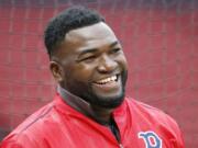 Former Boston Red Sox slugger David Ortiz was hospitalized Monday following surgery for a gunshot wound after being ambushed by a man in a bar in his native Dominican Republic, authorities said.