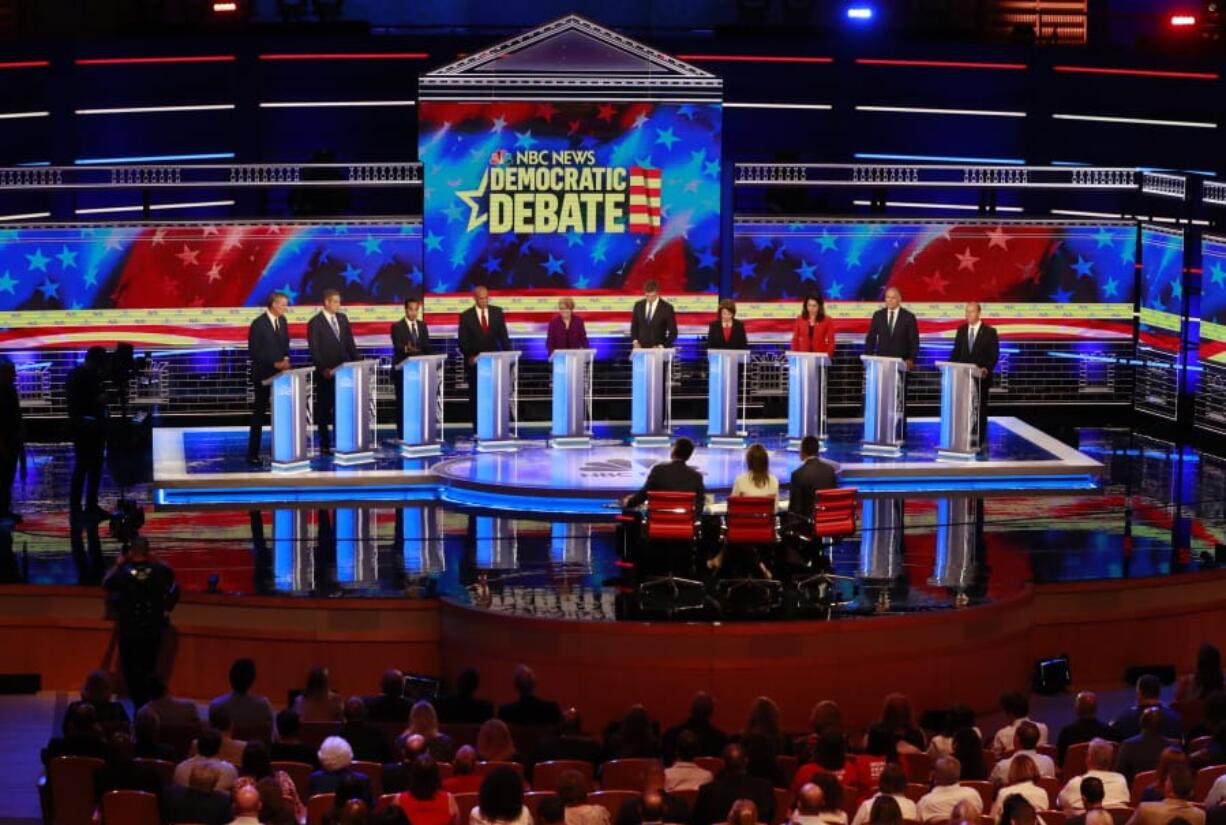 Democratic presidential candidates, from left, New York City Mayor Bill de Blasio, Rep. Tim Ryan, D-Ohio, former Housing and Urban Development Secretary Julian Castro, Sen. Cory Booker, D-N.J., Sen. Elizabeth Warren, D-Mass., former Texas Rep. Beto O’Rourke, Sen. Amy Klobuchar, D-Minn., Rep. Tulsi Gabbard, D-Hawaii, Washington Gov. Jay Inslee and former Maryland Rep. John Delaney participate in a debate Wednesday in Miami.