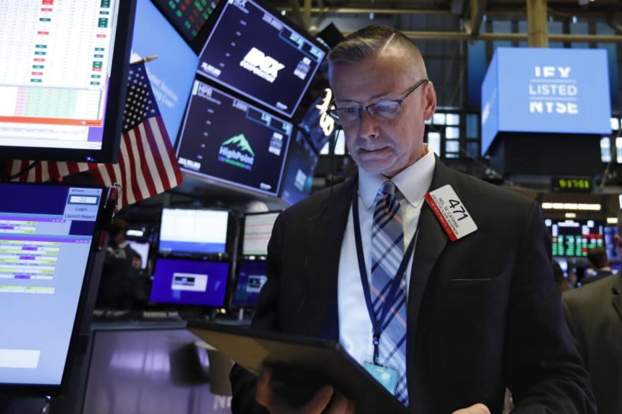 Trader Neil Catania works on the floor of the New York Stock Exchange, Tuesday, June 18, 2019. Stocks are opening higher on Wall Street following big gains in Europe after the head of the European Central Bank said it was ready to cut interest rates and provide more economic stimulus if necessary.