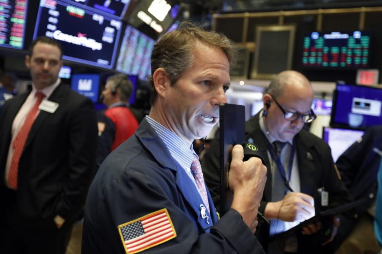 FILE - In this June 19, 2019, file photo trader Robert Chamak works on the floor of the New York Stock Exchange. The U.S. stock market opens at 9:30 a.m. EDT on Tuesday, June 25.