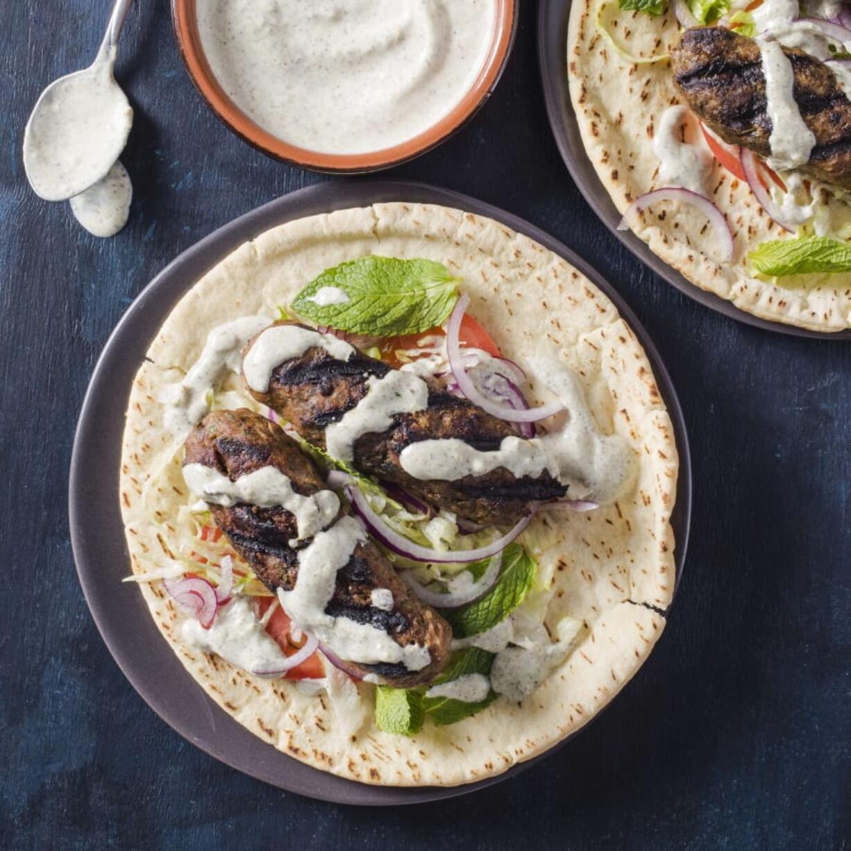 Grilled Lamb Kofte with Yogurt Sauce (Carl Tremblay/America’s Test Kitchen via AP)