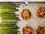 This undated photo provided by America’s Test Kitchen in June 2019 shows Salmon Burgers. This recipe appears in the cookbook “One-Pan Wonders.” (Daniel J.