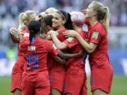 United States’ Alex Morgan, center, celebrates after scoring the opening goal during the Women’s World Cup Group F soccer match between United States and Thailand at the Stade Auguste-Delaune in Reims, France, Tuesday, June 11, 2019.