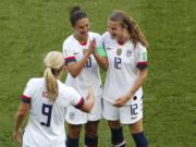 United States’ Carli Lloyd , center, celebrates with Lindsey Horan and Tierna Davidson, right, after scoring the opening goal during the Women’s World Cup Group F soccer match between the United States and Chile at the Parc des Princes in Paris, Sunday, June 16, 2019.