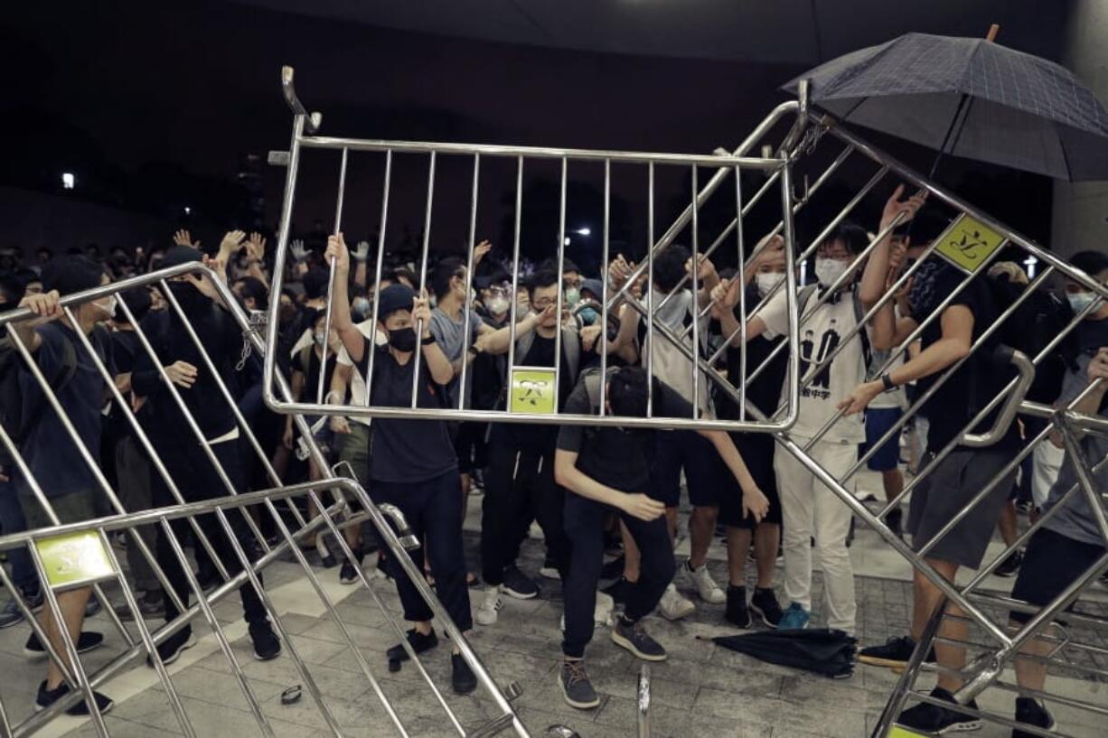 Protesters use barriers against the proposed amendments to the extradition law at the Legislative Council in Hong Kong during the early hours of Monday, June 10, 2019. The extradition law has aroused concerns that this legislation would undermine the city’s independent judicial system as it allows Hong Kong to hand over fugitives to the jurisdictions that the city doesn’t currently have an extradition agreement with, including mainland China, where a fair trial might not be guaranteed.