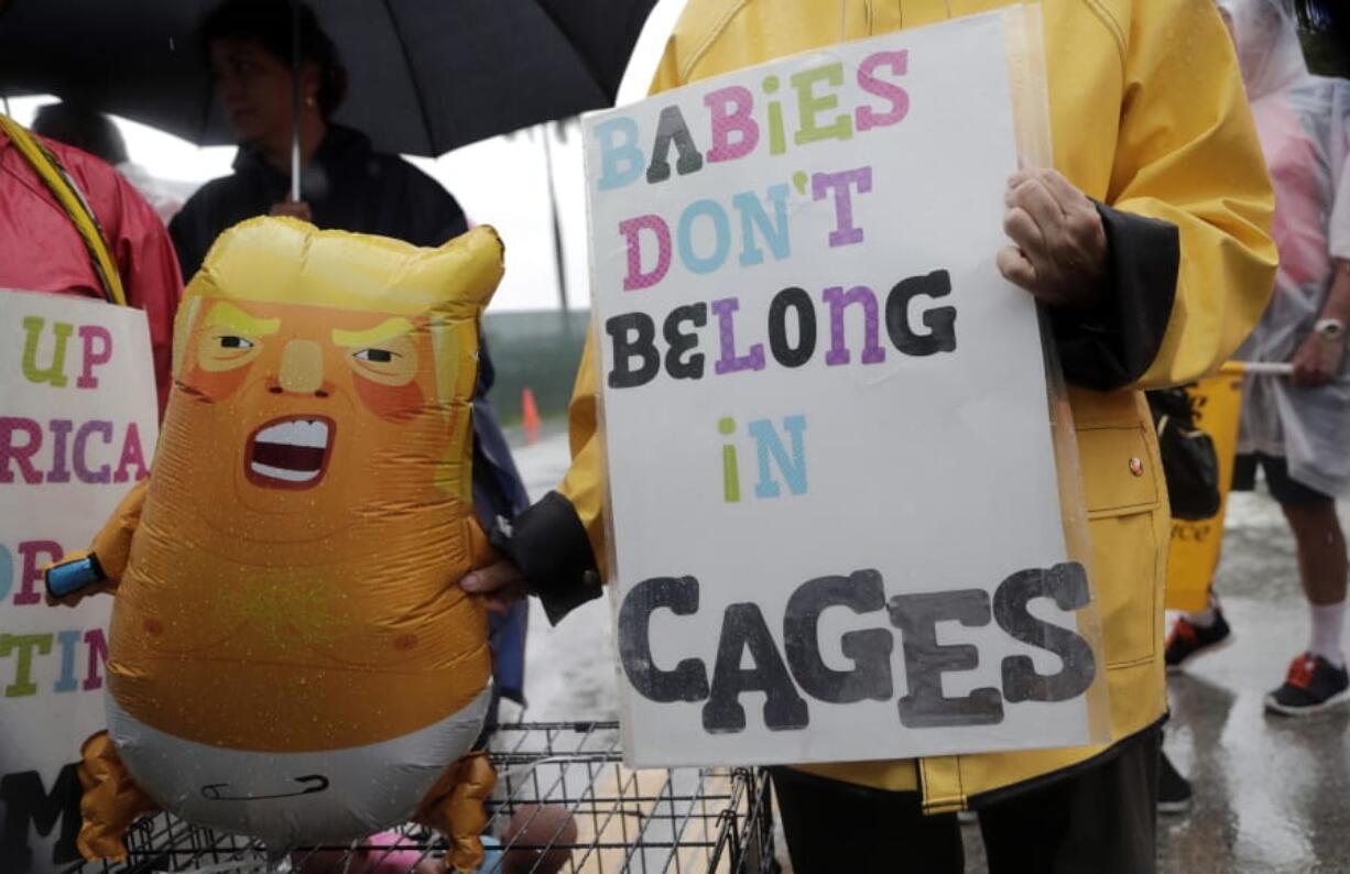 Protesters hold an inflatable doll in the likeness of President Donald Trump outside of the Homestead Temporary Shelter for Unaccompanied Children, Sunday, June 16, 2019, in Homestead, Fla. A coalition of religious groups and immigrant advocates said they want the Homestead detention center closed.