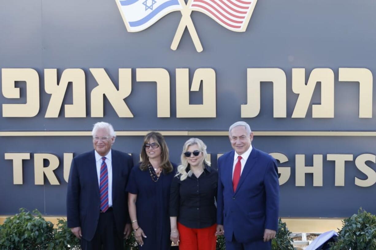 Israeli Prime Minister Benjamin Netanyahu, right, his wife, Sara, United States Ambassador to Israel David Friedman, left, his wife, Tammy, pose during the inauguration of a new settlement named after President Donald Trump in the Golan Heights, Sunday.