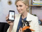 Actress and pet advocate Jane Lynch messages a vet via Vet Chat on Tuesday in New York.