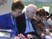 President Jimmy Carter and Rosalynn Carter bow their heads in prayer with members and visitors during the worship service at Maranatha Baptist Church less than a month after the 39th U.S. president and Plains native fell breaking his hip, on Sunday, June 9, 2019, in Plains, Ga.