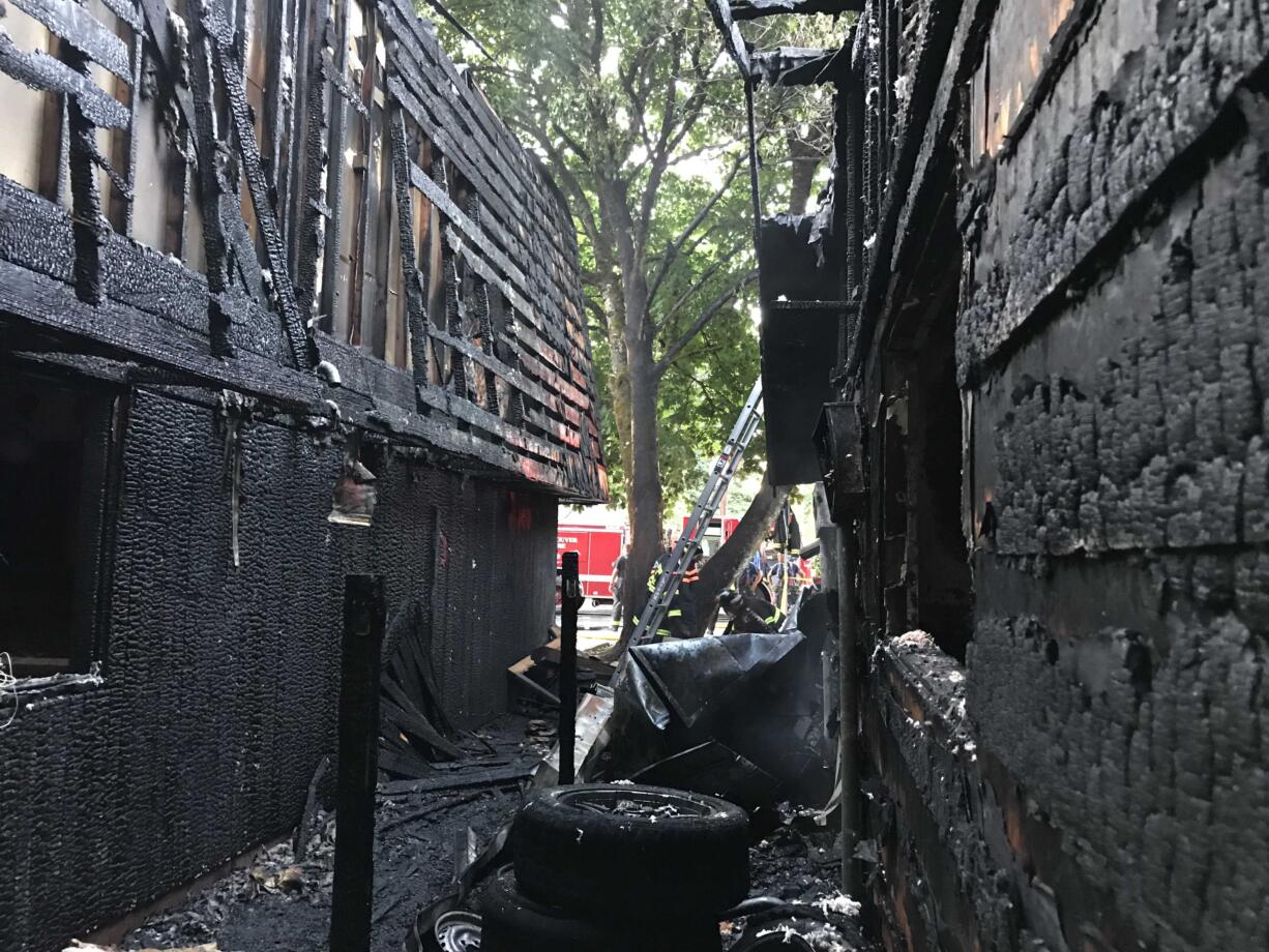 A second alarm fire damaged a two-story duplex and one-story house Sunday night in the Maplewood neighborhood, displacing at least 26 residents (Photo courtesy of the Vancouver Fire Department).