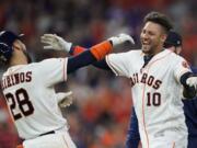 Houston Astros’ Yuli Gurriel (10) celebrates with Robinson Chirinos (28) after a baseball game against the Seattle Mariners Saturday, June 29, 2019, in Houston. Gurriel hit the game-ending RBI-double to score Michael Brantley in the 10th inning. The Astros won 6-5. (AP Photo/David J.