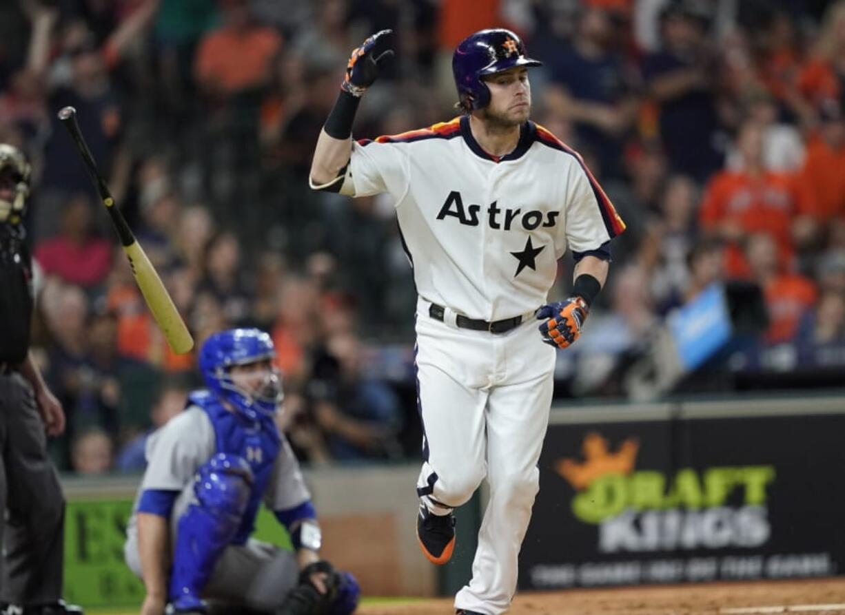 Houston Astros’ Josh Reddick tosses his bat after hitting a home run against the Seattle Mariners during the eighth inning of a baseball game Friday, June 28, 2019, in Houston. (AP Photo/David J.