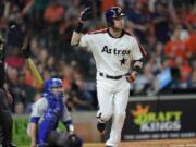 Houston Astros’ Josh Reddick tosses his bat after hitting a home run against the Seattle Mariners during the eighth inning of a baseball game Friday, June 28, 2019, in Houston. (AP Photo/David J.