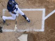 Milwaukee Brewers’ Orlando Arcia hits a three-run home run during the fourth inning of a baseball game against the Seattle Mariners Thursday, June 27, 2019, in Milwaukee.