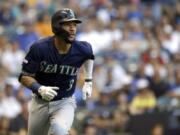 Seattle Mariners’ J.P. Crawford watches his RBI triple during the second inning of the team’s baseball game against the Milwaukee Brewers on Wednesday, June 26, 2019, in Milwaukee.