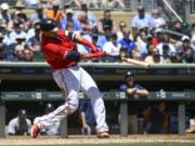 Minnesota Twins designated hitter Nelson Cruz hits a solo home run off a pitch by Seattle Mariners pitcher Yusei Kikuchi during the third inning of a baseball game, Thursday, June 13, 2019, in Minneapolis.