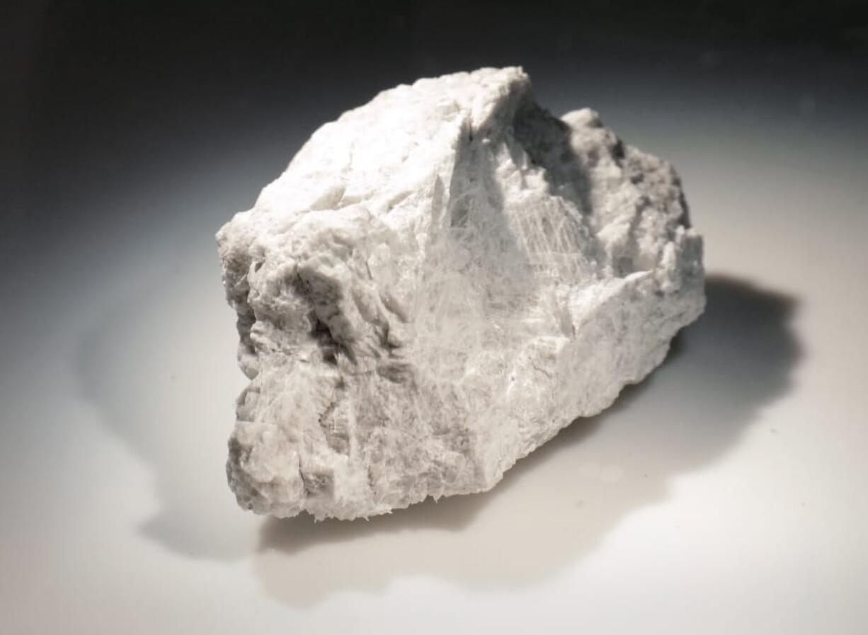 The “Genesis Rock” is a 4.4 billion-year-old anorthosite sample approximately 2 inches in length brought back by Apollo 15.