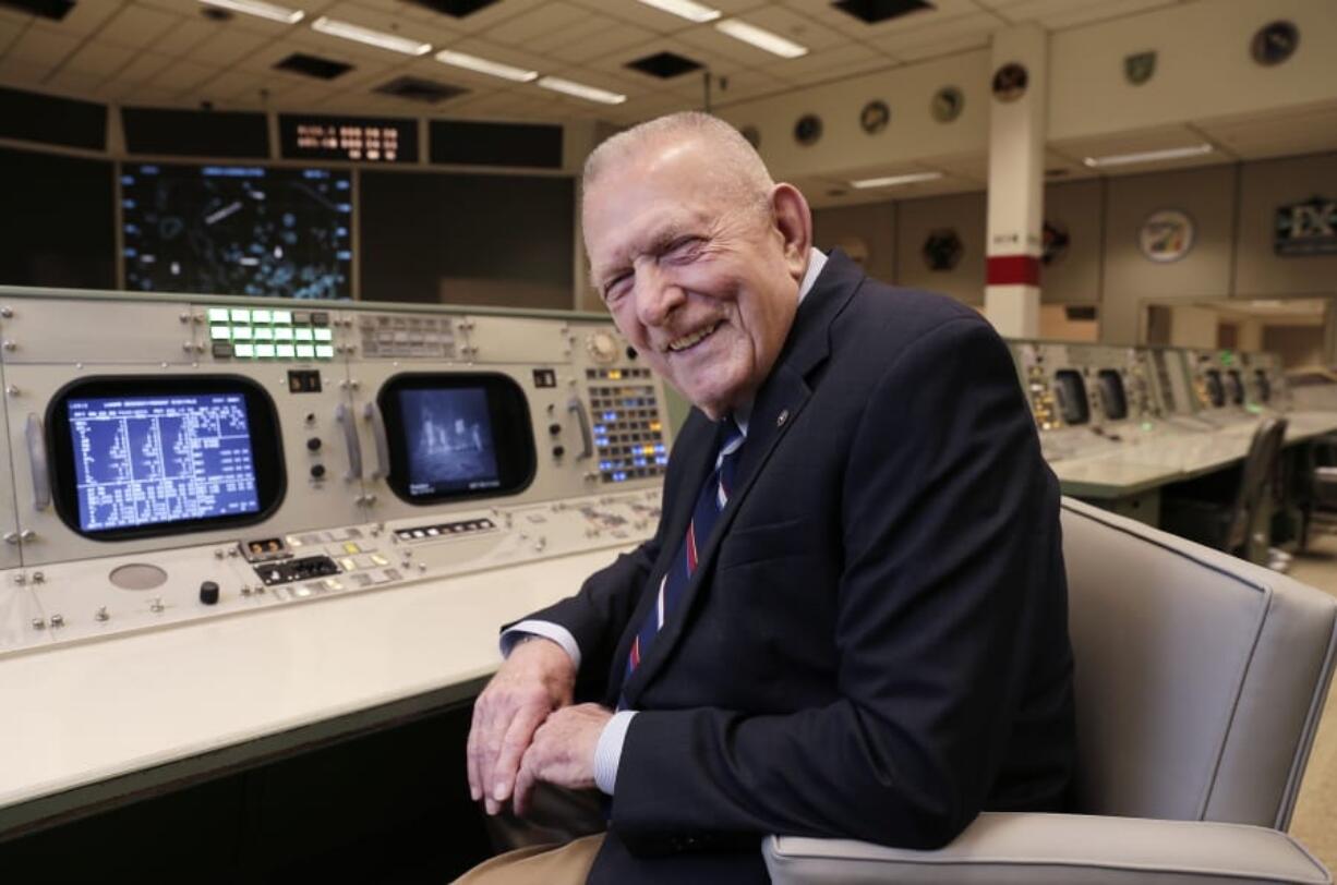 Gene Kranz, aerospace engineer, fighter pilot, an Apollo-era flight director and later director of NASA flight operations, sits at the console where he worked during the Gemini and Apollo missions at the NASA Johnson Space Center Monday, June 17, 2019, in Houston. “The impact is incredible,” Kranz, 85, said. With all the vacated seats, the room reminded him of a shift change when flight controllers would hit the restroom.