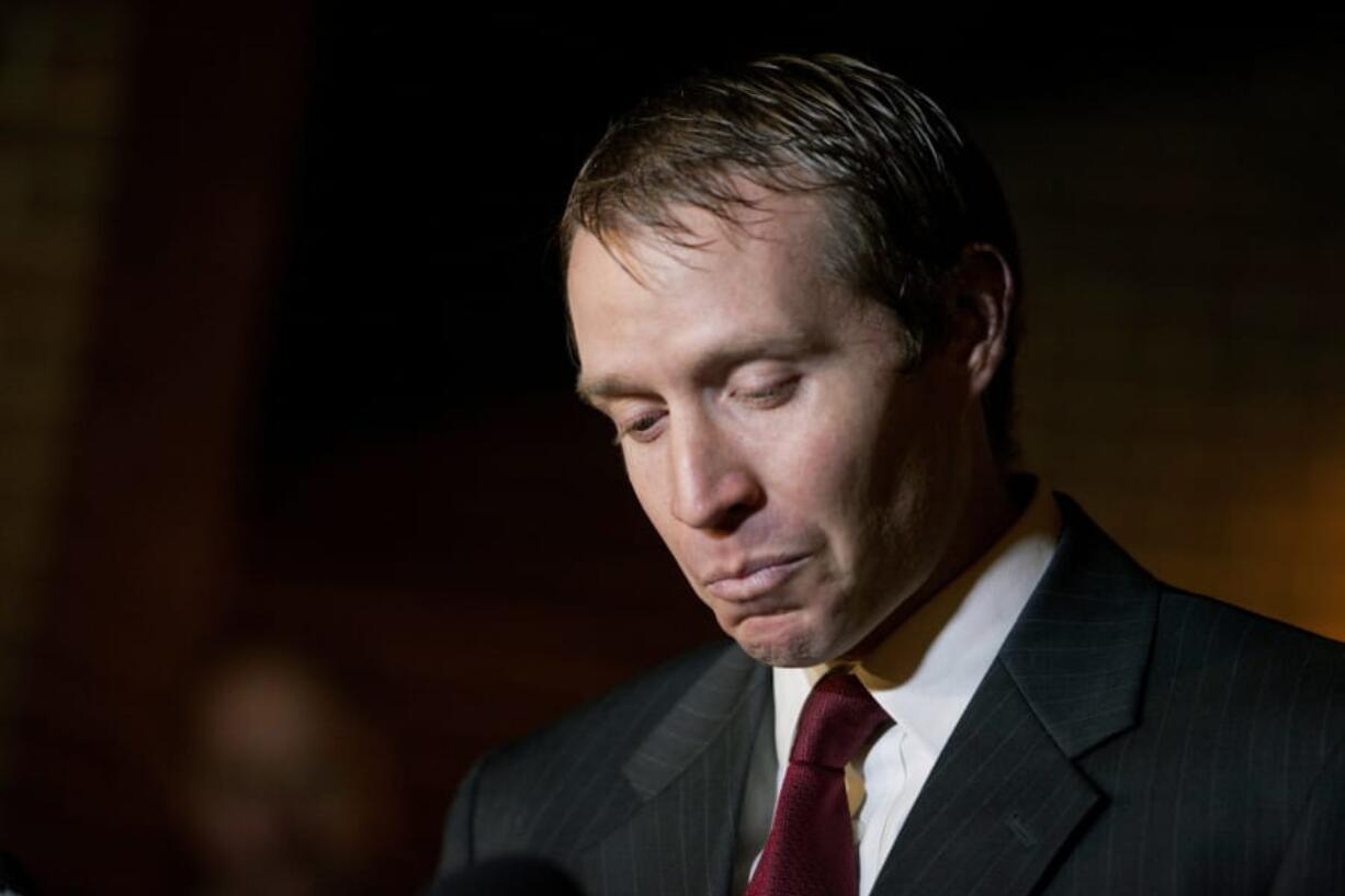 In this Dec. 15, 2012 file photo, Robbie Parker, the father of six-year-old Emilie who was killed in the Sandy Hook Elementary School shooting, speaks during a press conference, in Newtown, Conn. Parker spent years trying to ignore the people who would take to the Internet to call him a crisis actor or claim his daughter never existed. He has now changed course, joining the families of other victims in taking legal action against deniers.