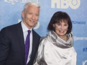 FILE - In this April 4, 2016 file photo, CNN anchor Anderson Cooper and Gloria Vanderbilt attend the premiere of “Nothing Left Unsaid” at the Time Warner Center in New York. Vanderbilt, the “poor little rich girl” heiress at the center of a scandalous custody battle of the 1930s and the designer jeans queen of the 1970s and ‘80s, died on Monday, June 17, 2019, at 95, according to her son, Cooper.