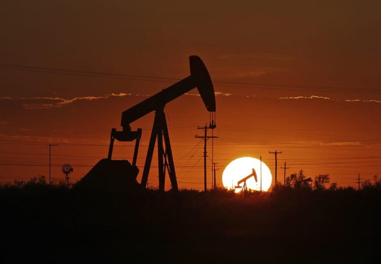 A pump jack operates in an oil field on June 11 in the Permian Basin in Texas.