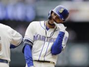 Seattle Mariners’ J.P. Crawford reacts on first after hitting a two-run single against the Baltimore Orioles during the third inning of a baseball game, Sunday, June 23, 2019, in Seattle.