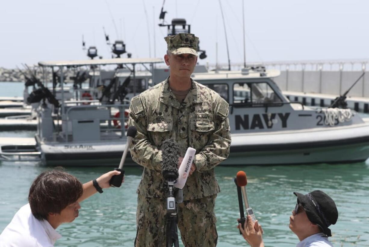 Cmdr. Sean Kido of the U.S. Navy’s 5th Fleet talks to journalists at a 5th Fleet Base near Fujairah, United Arab Emirates, Wednesday, June 19, 2019. Cmdr.