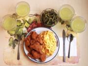 This undated photo provided by the National Institutes of Health in June 2019 shows an “ultra-processed” lunch including brand name macaroni and cheese, chicken tenders, canned green beans and diet lemonade. Researchers found people ate an average of 500 extra calories a day when fed mostly processed foods, compared with when the same people were fed minimally processed foods. That’s even though researchers tried to match the meals for nutrients like fat, fiber and sugar.