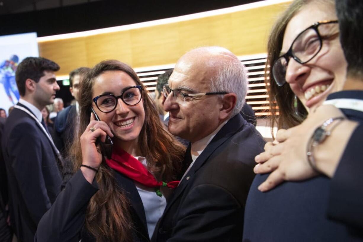 Italian skier Sofia Goggia celebrates with members of the Italian delegation after International Olympic Committee (IOC) president Thomas Bach from Germany announced that Milan-Cortina has won the bid to host the 2026 Winter Olympic Games, during the first day of the 134th Session of the International Olympic Committee (IOC), at the SwissTech Convention Centre, in Lausanne, Switzerland, Monday, June 24, 2019. Italy will host the 2026 Olympics in Milan and Cortina d’Ampezzo, taking the Winter Games to the Alpine country for the second time in 20 years.