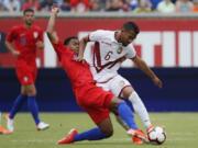 Venezuela midfielder Yangel Herrera (6) and United States midfielder Weston McKennie (8) vie for the ball during the first half of an international friendly soccer match, Sunday, June 9, 2019, in Cincinnati.